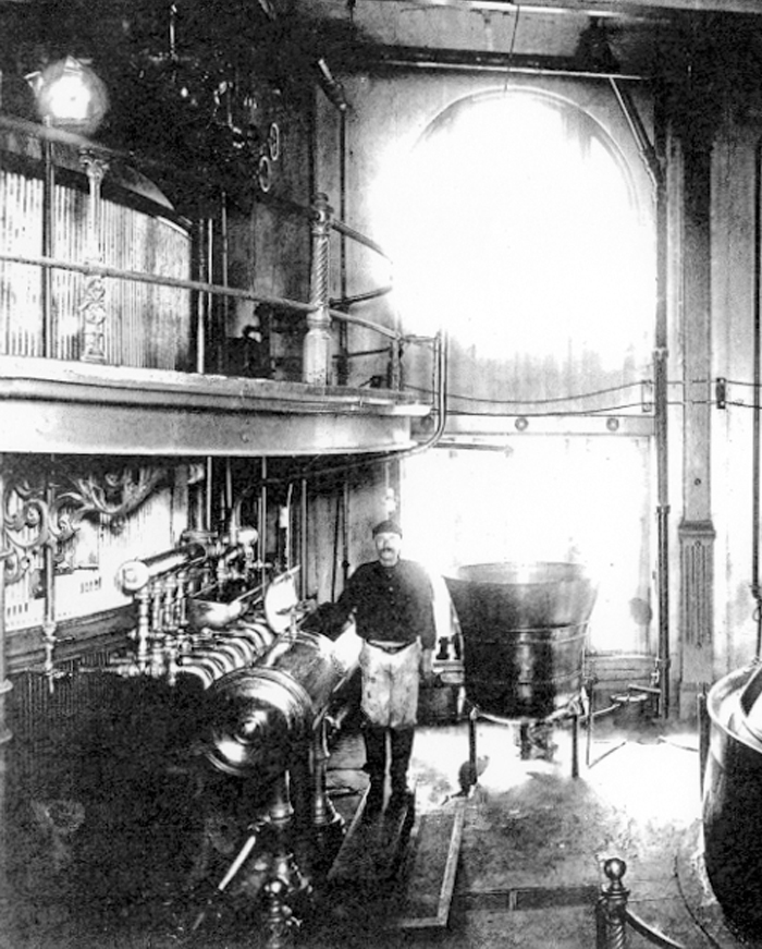 A black and white picture of an employee working at the Pearl Brewery
